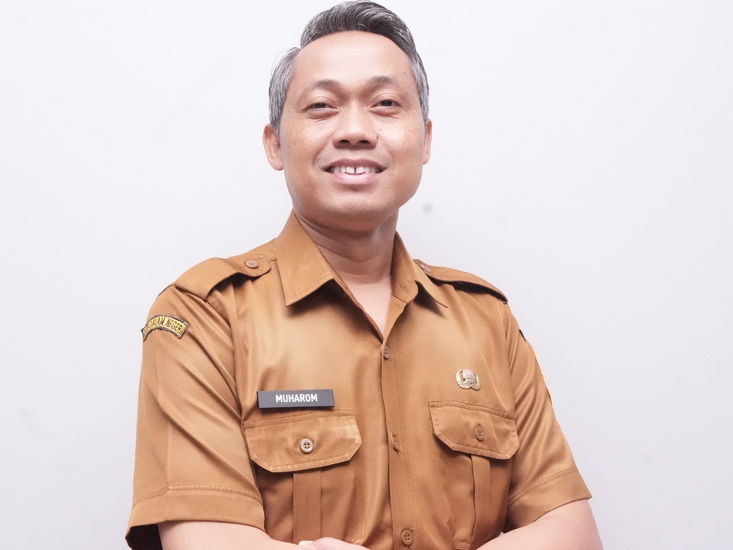 H. Muharom, S.Sos., M.AP.