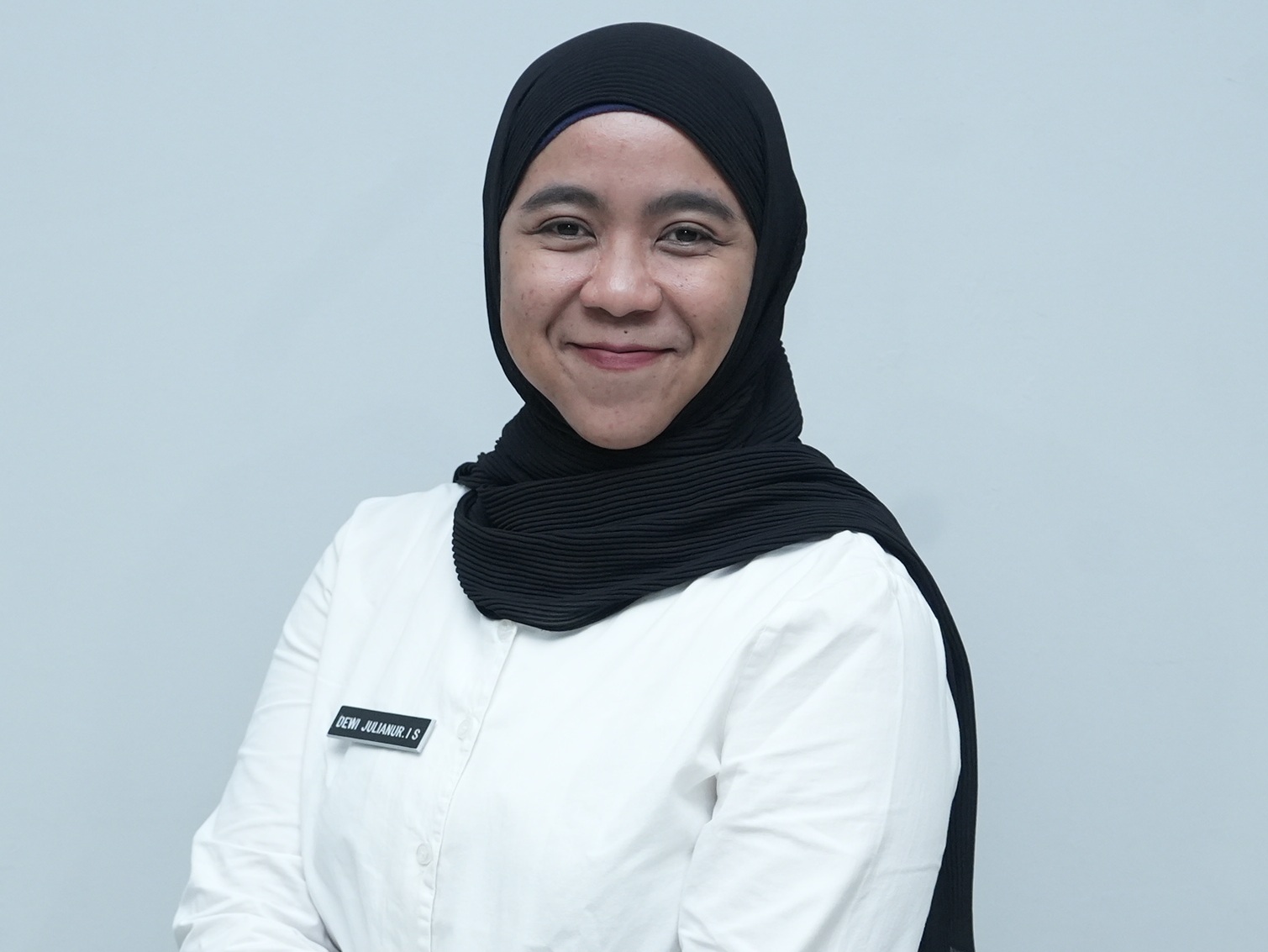 Dewi Julianur IS,S.I.Kom